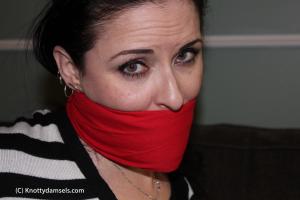 www.knottydamsels.com - Caroline Pierce Photo Set: Detective Gagged with Red Cloth thumbnail